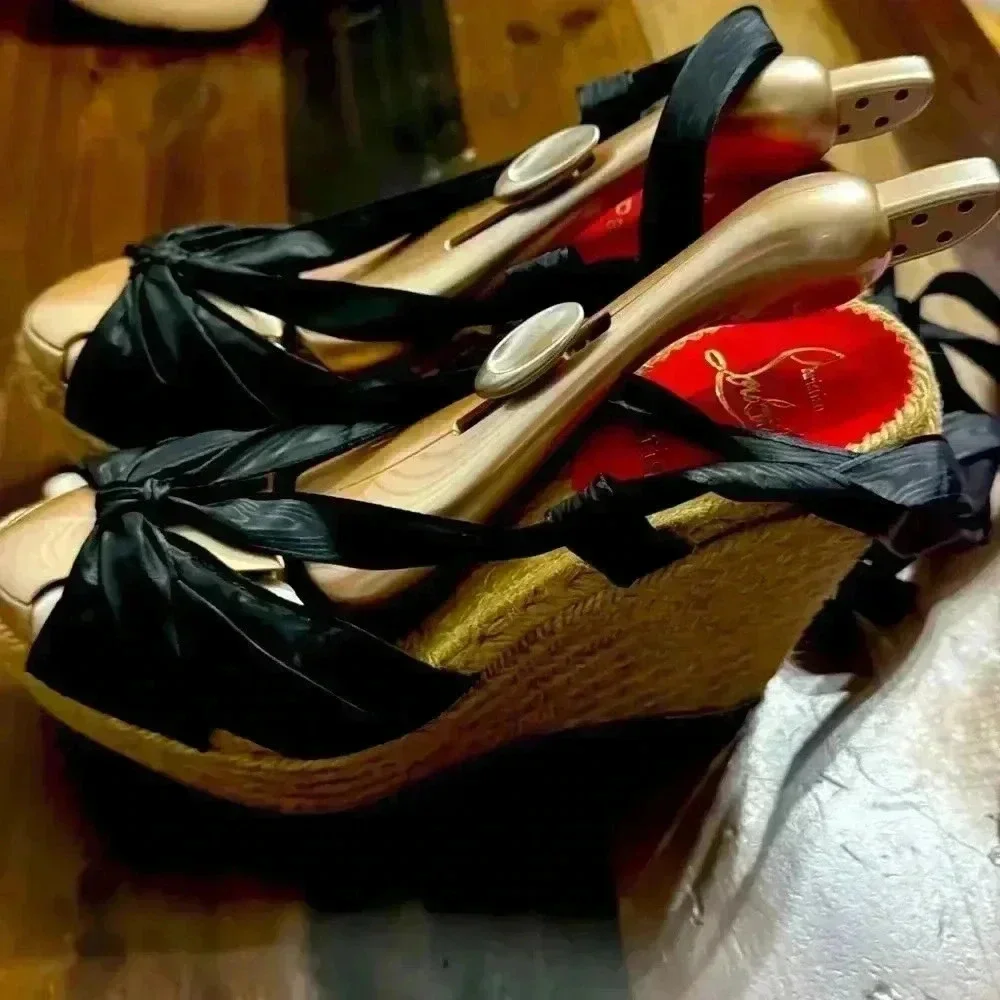 Christian Louboutin lace up espadrilles.